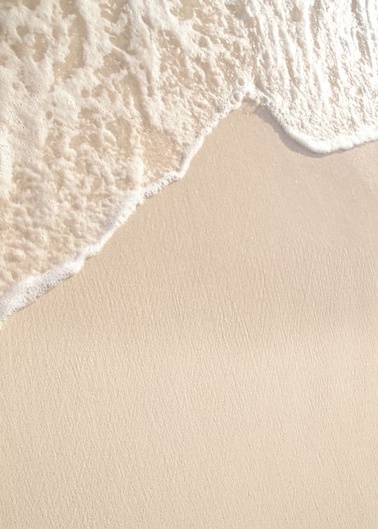 Gentle Wave on Sandy Beach